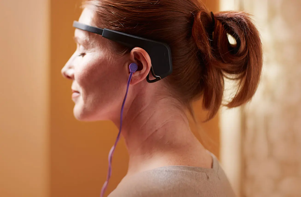 Woman in headset with eyes closed